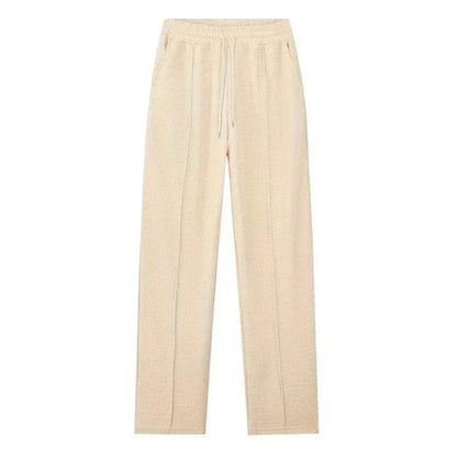 Pantalón beige de tela ligera con cintura elástica y cordón, estilo casual para mujer