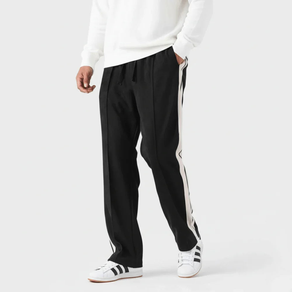 Pantalón deportivo negro para hombre con franjas blancas laterales, estilo casual