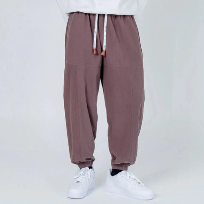 Pantalón jogger gris para hombre con cintura elástica y cordón, estilo casual